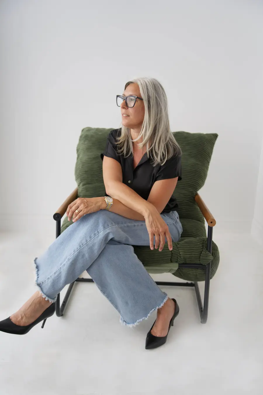 Jamie Mazuryk in a green armchair